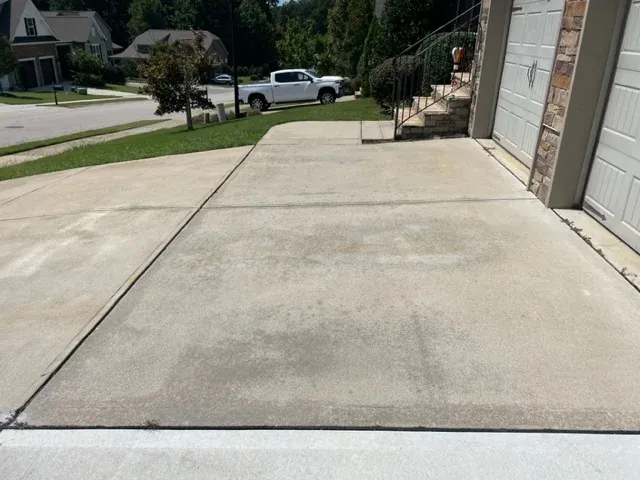 dirty driveway with dark streaks in Wake Forest NC