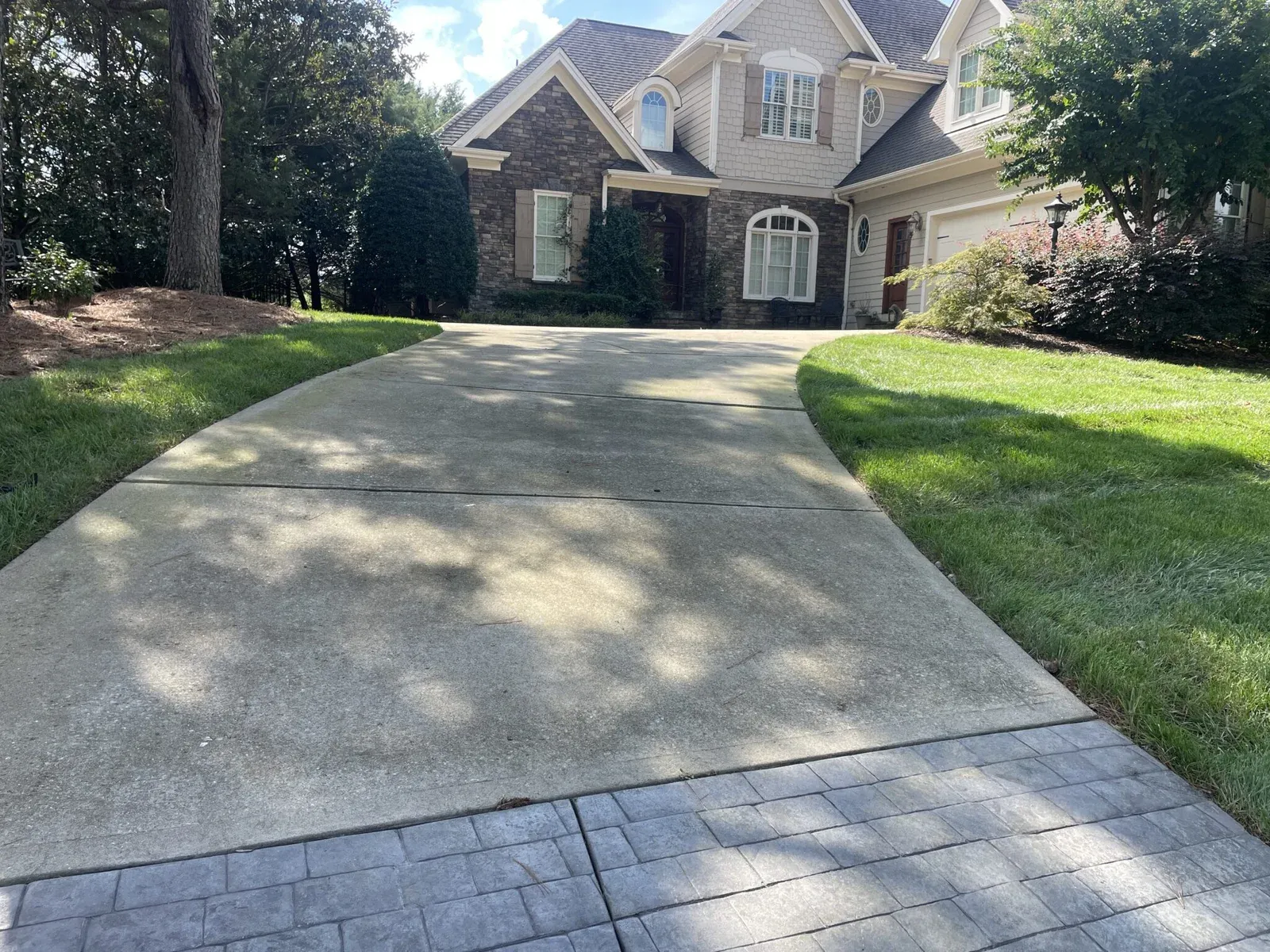 picture of a dirty driveway, house in view in Wake Forest Nc